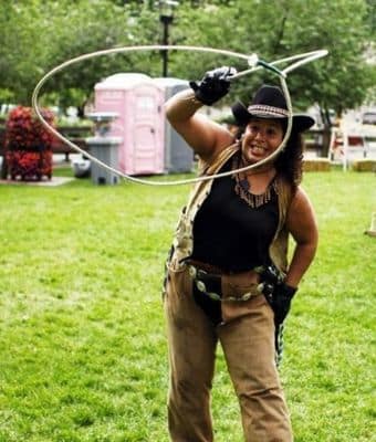 Cowboy dressed entertainer handling lasso